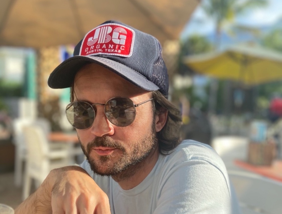 SONG PREMIERE: Texas Troubadour Jonny Burke Recalls Darkly Humorous Experience in “I Cut Off My Ankle Monitor To Be Here”