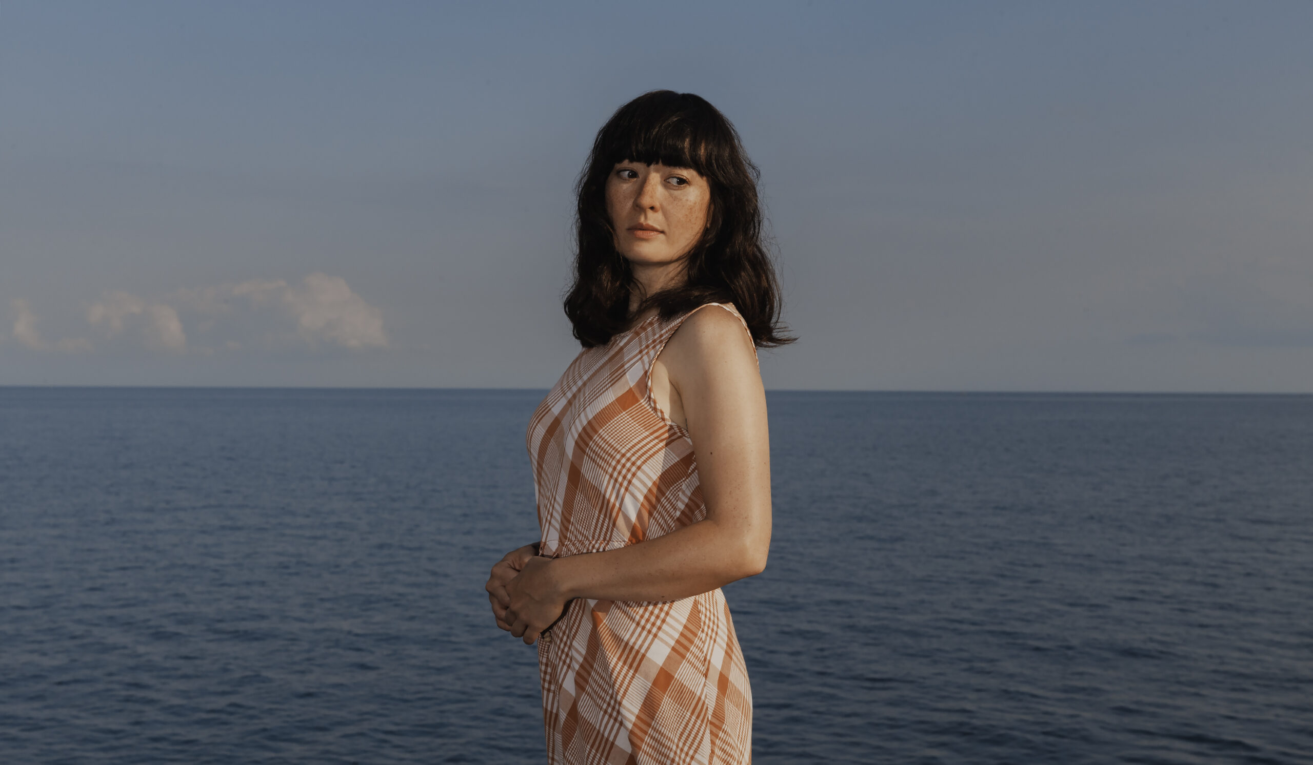 LISTEN: Julie Arsenault Brings On A Nostalgic Earworm With “Tiny Beam of Light”